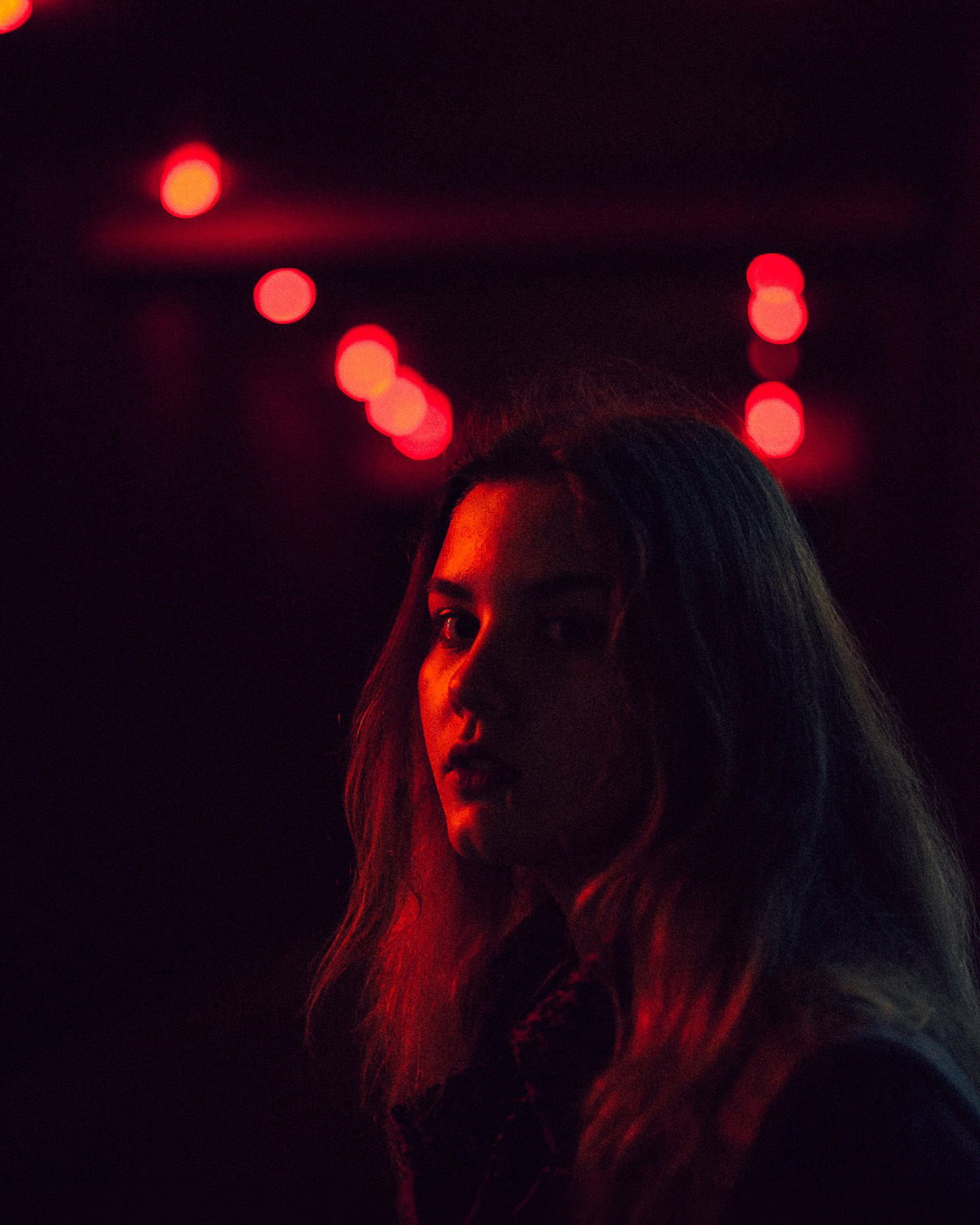 Cinematic red-light portrait
